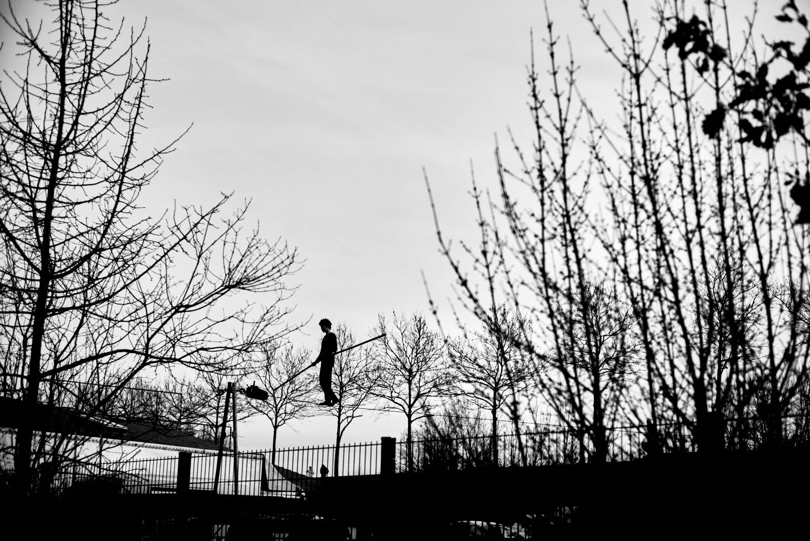 balancing act from a circus in black and white