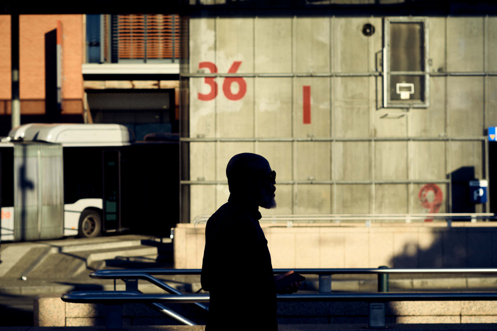 silhouette in front a graphic wall with numbers